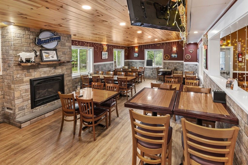 Dining room, Fireplace, Interior, Pendant Lights, Recessed Lighting, Stone Walls, Wooden Ceilings, Wood Texture Flooring