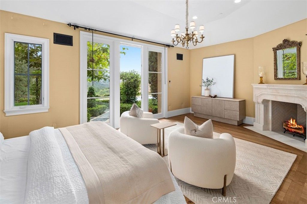 Bedroom, Chandelier, Fireplace, Interior, Recessed Lighting, Wood Texture Flooring