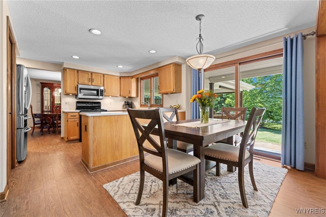 Dining room, Interior, Kitchen, Pendant Lights, Recessed Lighting, Stainless Steel Appliances, Wood Texture Flooring