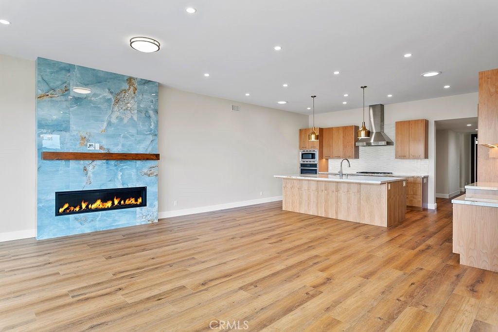 Fireplace, Interior, Kitchen, Pendant Lights, Recessed Lighting, Stainless Steel Appliances, Wood Texture Flooring