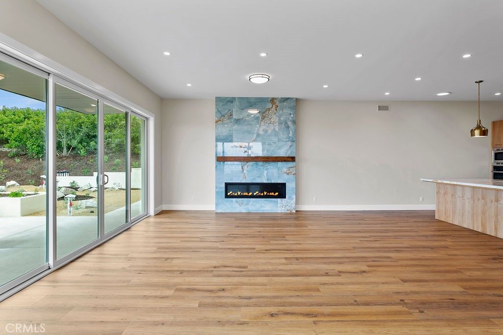 Empty room, Fireplace, Interior, Pendant Lights, Recessed Lighting, Wood Texture Flooring