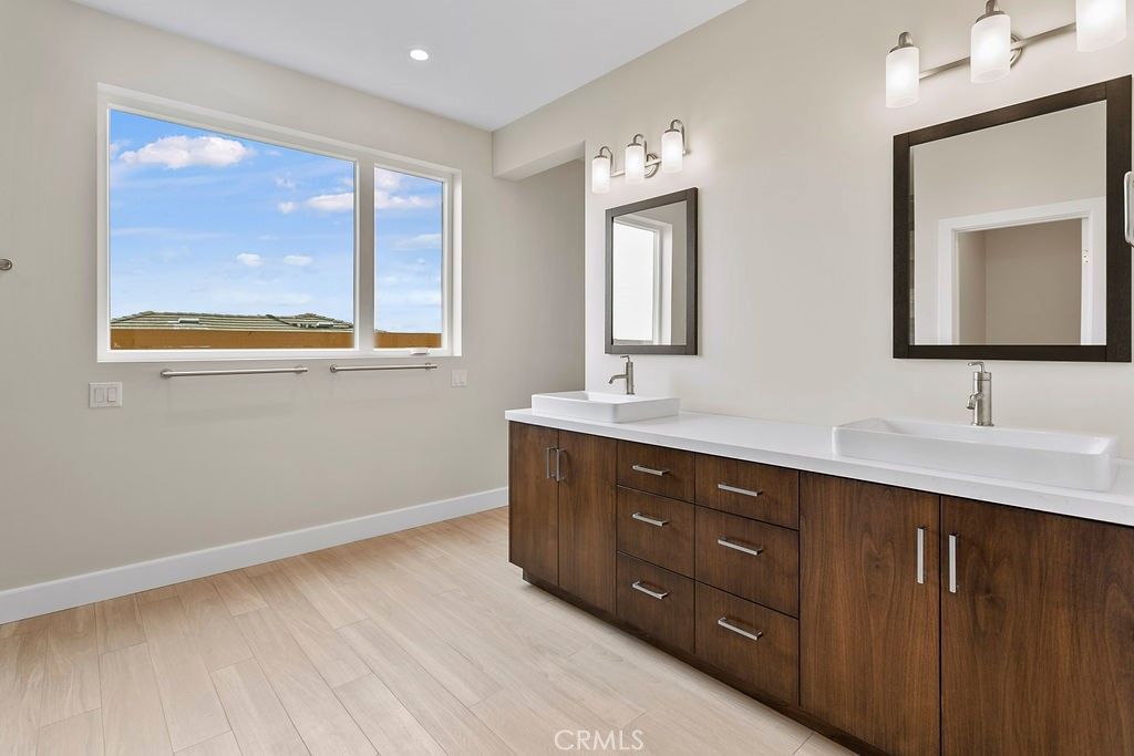 Bathroom, Dual Sink Vanities, Interior, Recessed Lighting, Wood Texture Flooring