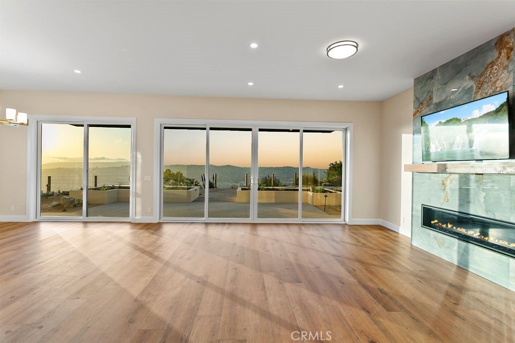 Empty room, Fireplace, Interior, Recessed Lighting, Water, Wood Texture Flooring