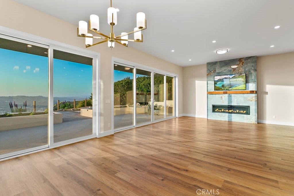 Empty room, Fireplace, Interior, Pendant Lights, Recessed Lighting, Wood Texture Flooring