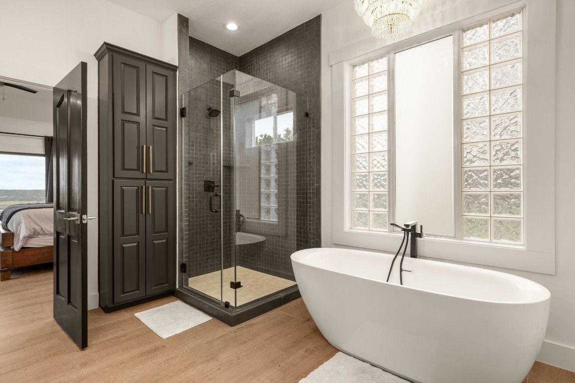 Bathroom, Free Standing Baths, Glass Shower, Interior, Recessed Lighting, Wood Texture Flooring