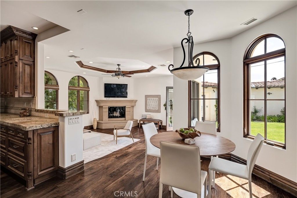 Dining room, Fireplace, Interior, Living room, Pendant Lights, Recessed Lighting, Wood Texture Flooring