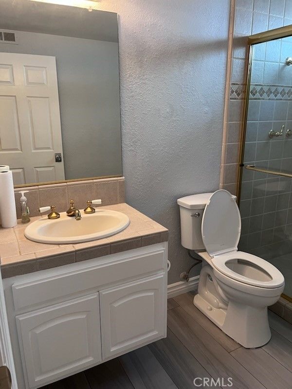 Bathroom, Glass Shower, Interior, Tile Countertops, Wood Texture Flooring