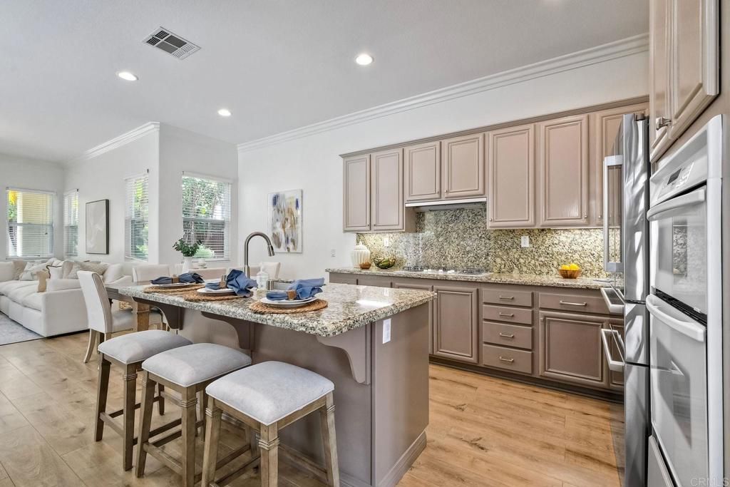 Dining room, Interior, Kitchen, Living room, Recessed Lighting, Stainless Steel Appliances, Wood Texture Flooring