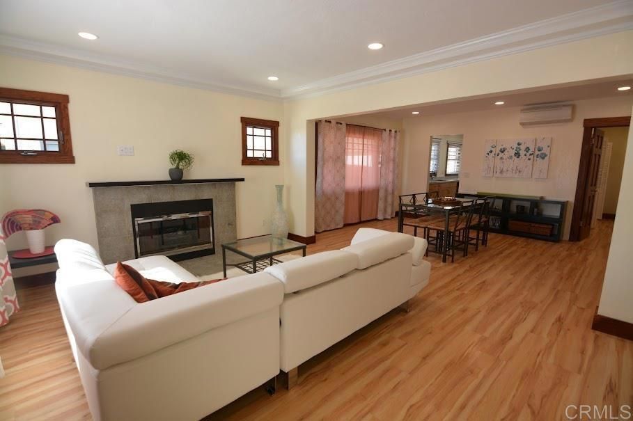 Dining room, Fireplace, Interior, Living room, Recessed Lighting, Wood Texture Flooring