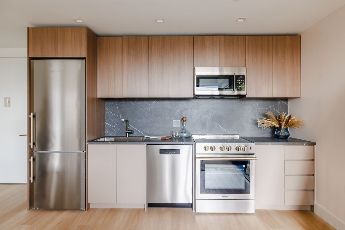 Interior, Kitchen, Marble Walls, Recessed Lighting, Stainless Steel Appliances, Wood Texture Flooring