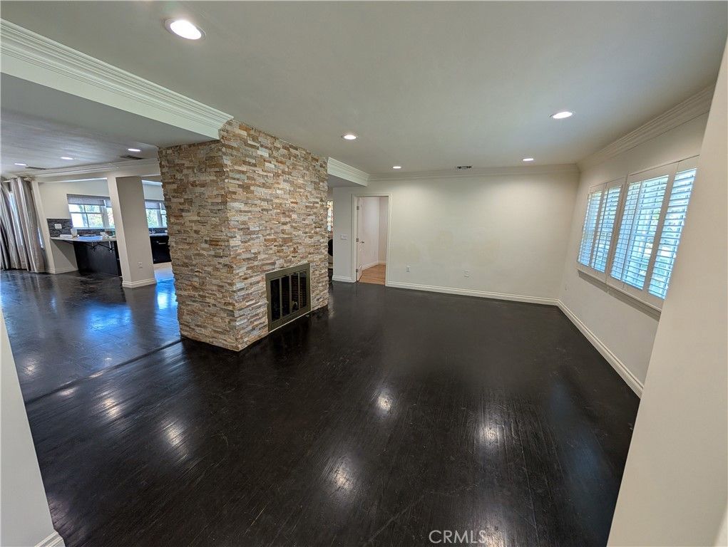 Empty room, Fireplace, Interior, Recessed Lighting, Stone Walls, Wood Texture Flooring
