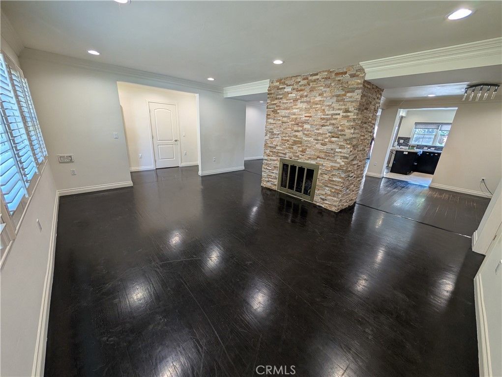 Empty room, Fireplace, Interior, Recessed Lighting, Stone Walls, Wood Texture Flooring