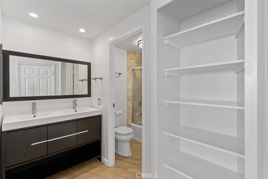 Bathroom, Dual Sink Vanities, Interior, Recessed Lighting, Wood Texture Flooring