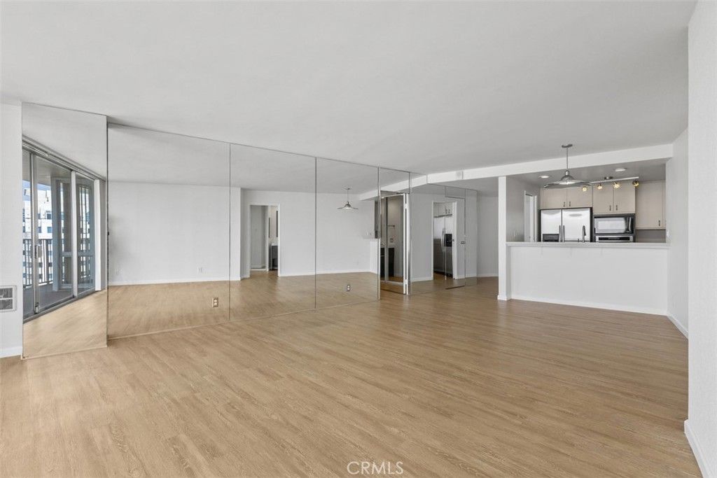 Empty room, Interior, Kitchen, Pendant Lights, Stainless Steel Appliances, Wood Texture Flooring