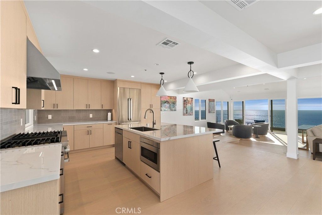 Dining room, Interior, Kitchen, Living room, Pendant Lights, Recessed Lighting, Stainless Steel Appliances, Water, Wood Texture Flooring