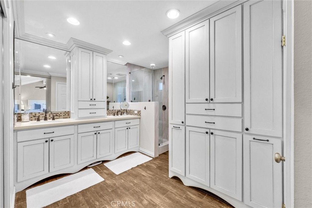 Bathroom, Dual Sink Vanities, Glass Shower, Interior, Recessed Lighting, Wood Texture Flooring