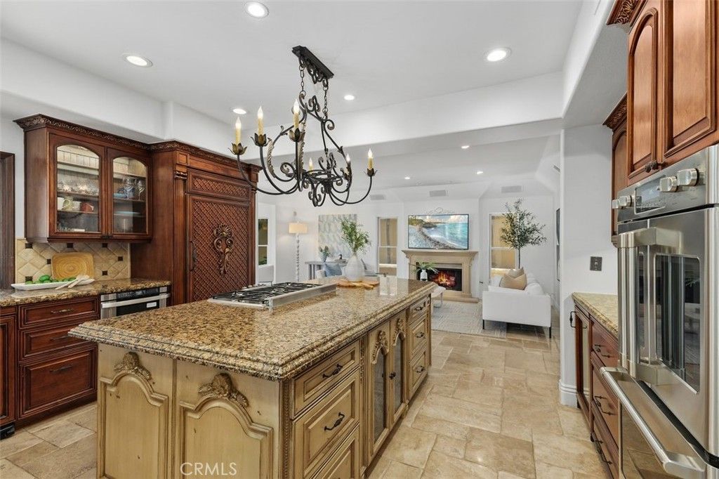 Chandelier, Fireplace, Interior, Kitchen, Living room, Recessed Lighting, Stainless Steel Appliances