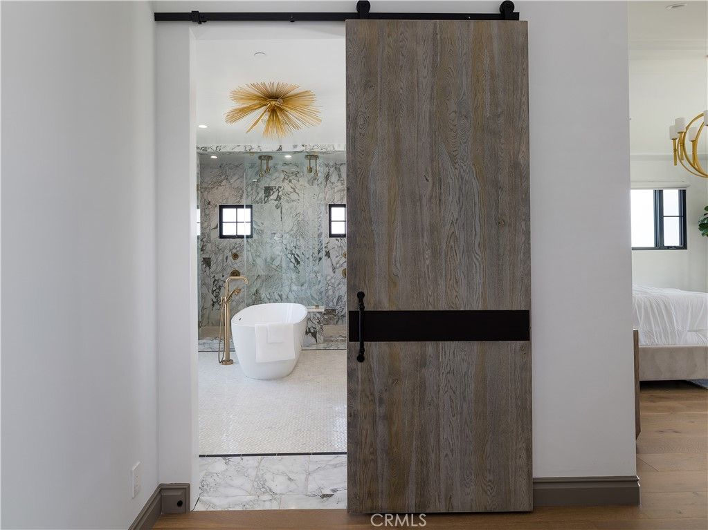 Bathroom, Free Standing Baths, Interior, Marble, Marble Walls, Recessed Lighting, Wood Texture Flooring
