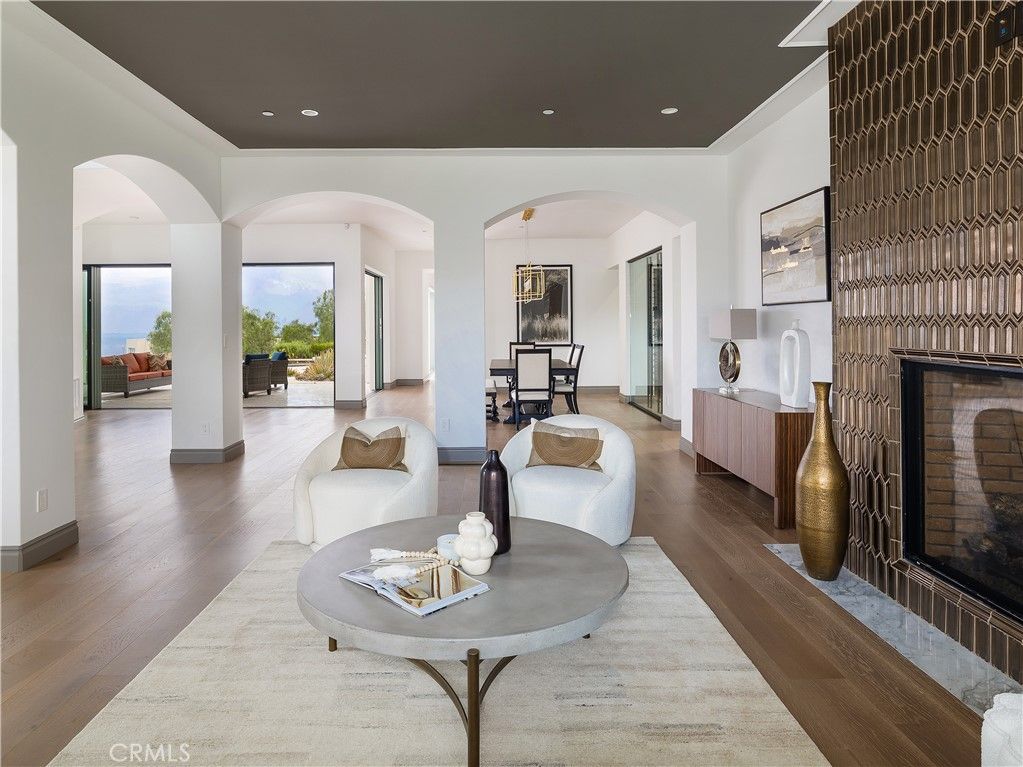 Dining room, Fireplace, Interior, Living room, Pendant Lights, Recessed Lighting, Wood Texture Flooring