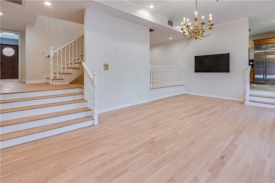 Chandelier, Empty room, Interior, Recessed Lighting, Stainless Steel Appliances, Wood Texture Flooring