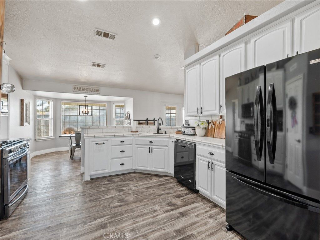 Interior, Kitchen, Pendant Lights, Recessed Lighting, Tile Countertops, Wood Texture Flooring