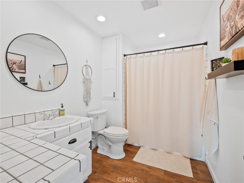 Bathroom, Interior, Recessed Lighting, Tile Countertops, Wood Texture Flooring