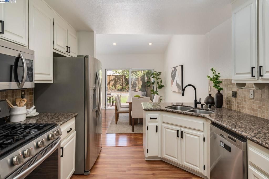 Dining room, Interior, Kitchen, Recessed Lighting, Stainless Steel Appliances, Wood Texture Flooring
