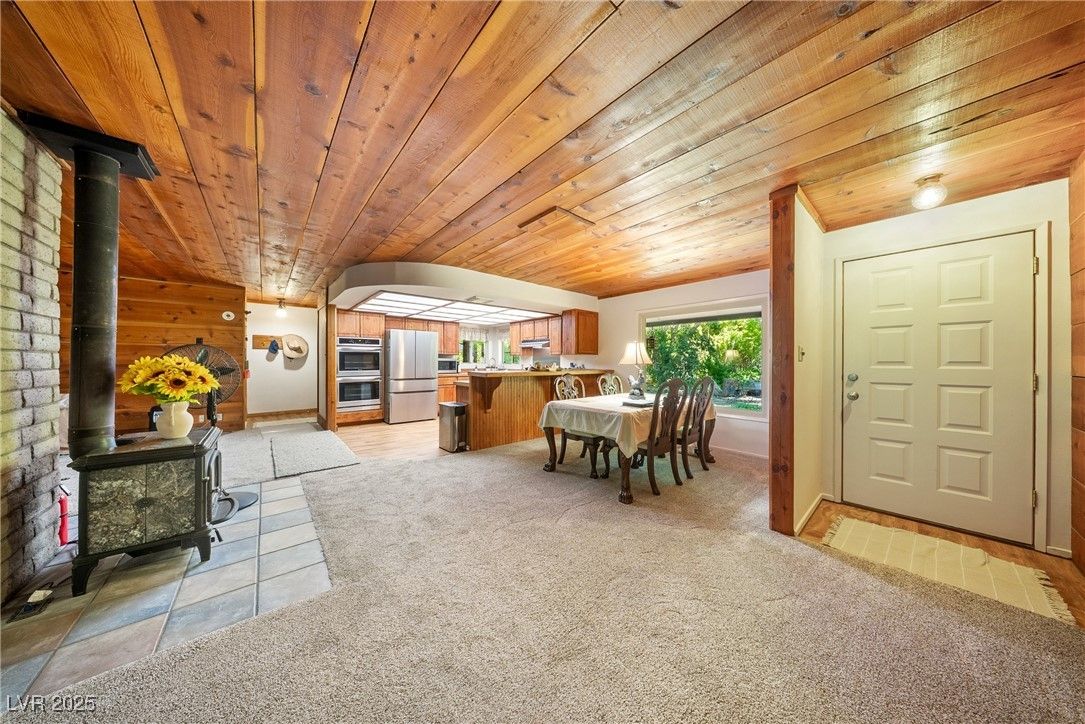 Dining room, Fireplace, Interior, Kitchen, Stainless Steel Appliances, Stone Walls, Wooden Ceilings
