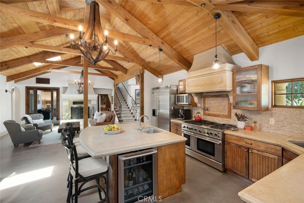 Chandelier, Dining room, Interior, Kitchen, Living room, Pendant Lights, Stainless Steel Appliances, Wooden Beams, Wooden Ceilings