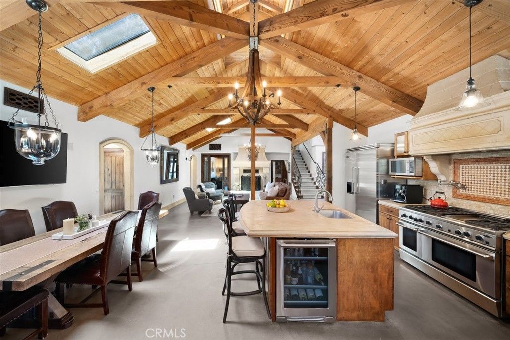 Chandelier, Dining room, Interior, Kitchen, Living room, Pendant Lights, Stainless Steel Appliances, Wooden Beams, Wooden Ceilings