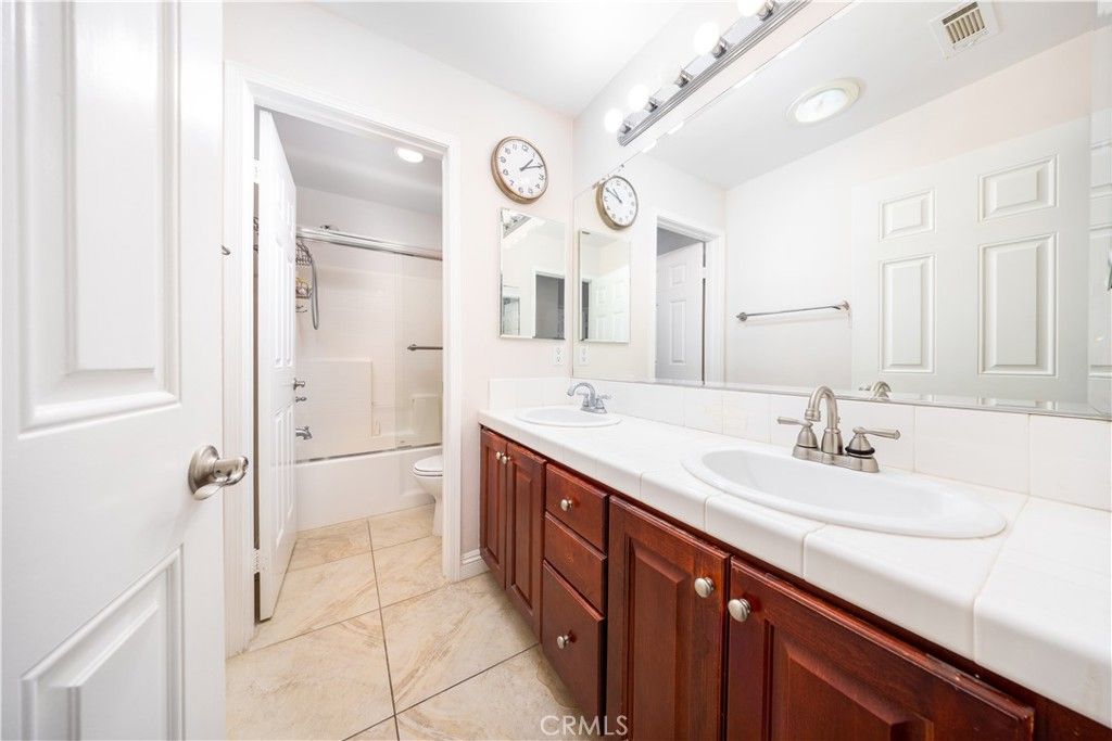 Bathroom, Dual Sink Vanities, Glass Shower, Interior, Recessed Lighting, Tile Countertops