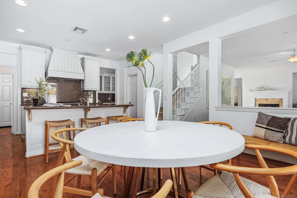 Dining room, Fireplace, Interior, Kitchen, Recessed Lighting, Wood Texture Flooring