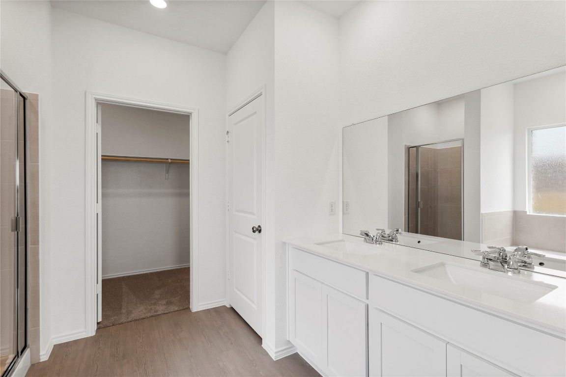 Bathroom, Dual Sink Vanities, Interior, Recessed Lighting, Wood Texture Flooring