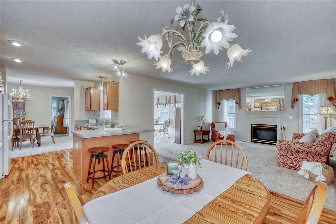 Chandelier, Dining room, Fireplace, Interior, Kitchen, Living room, Recessed Lighting, Wood Texture Flooring