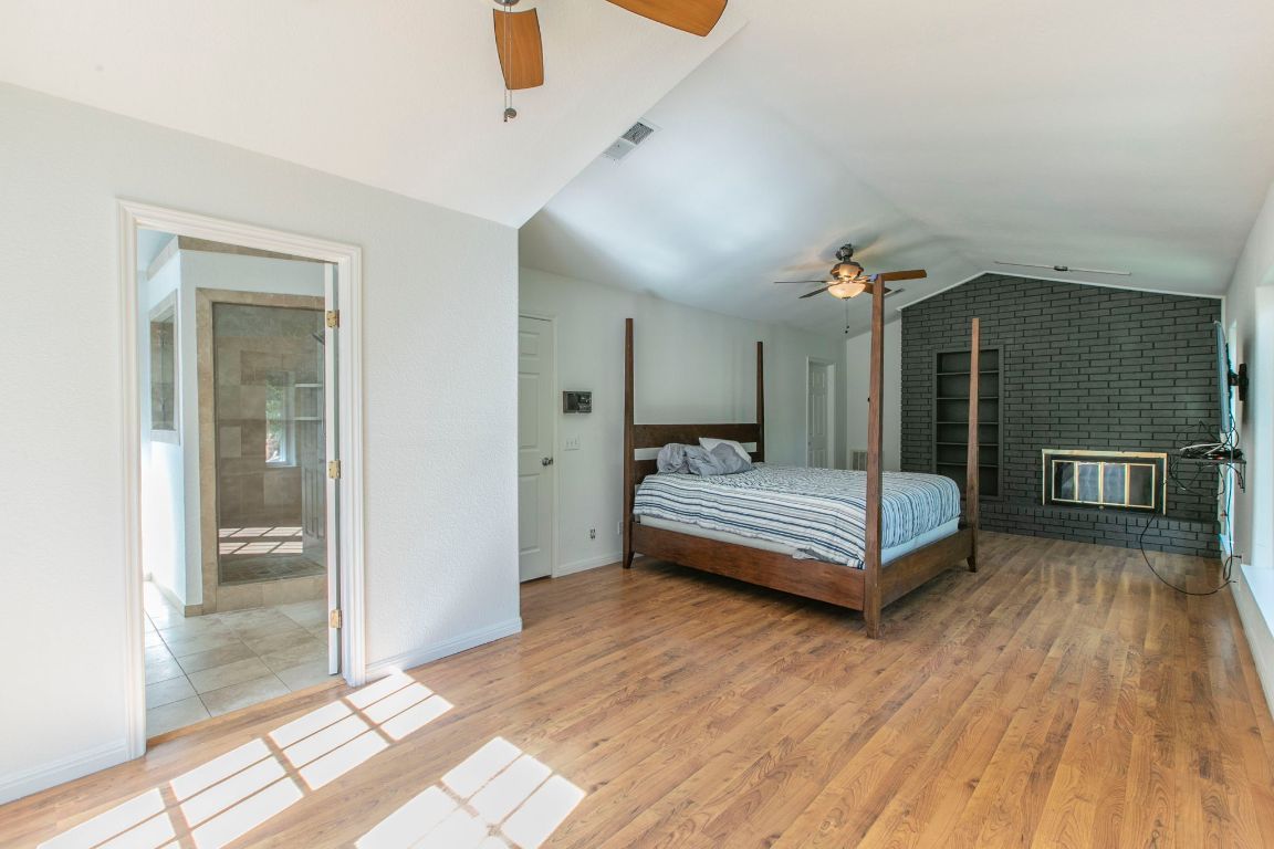 Bedroom, Fireplace, Interior, Stone Walls, Wood Texture Flooring