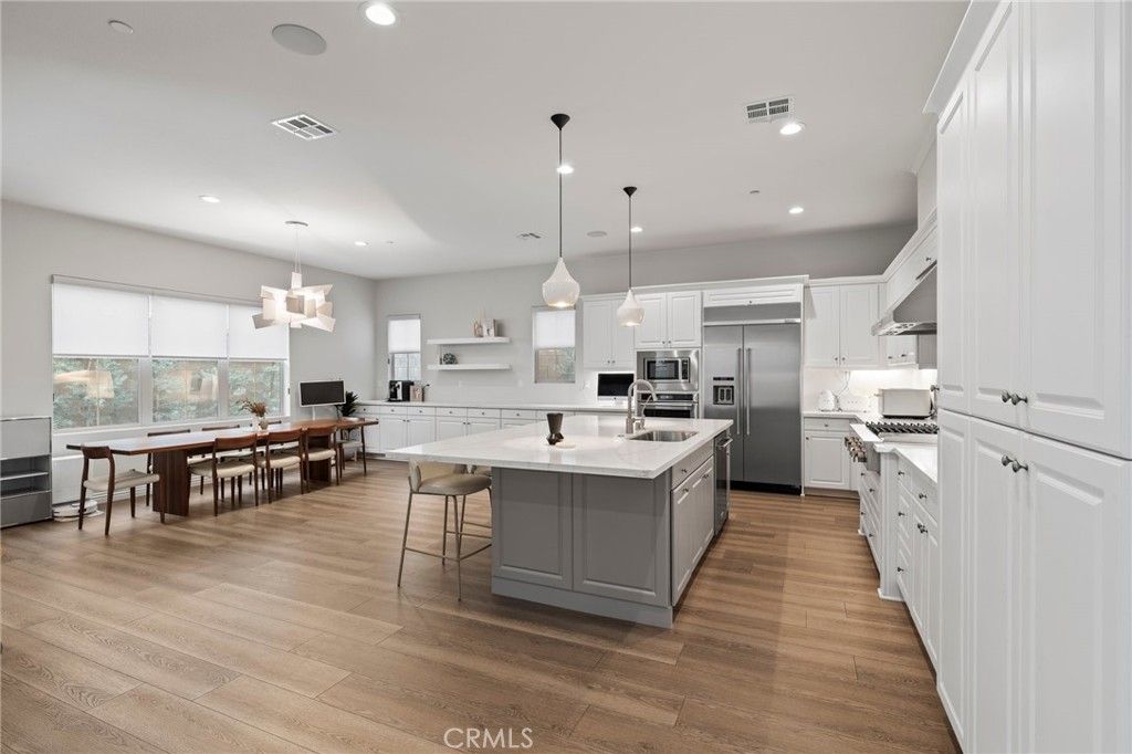 Dining room, Interior, Kitchen, Pendant Lights, Recessed Lighting, Stainless Steel Appliances, Wood Texture Flooring