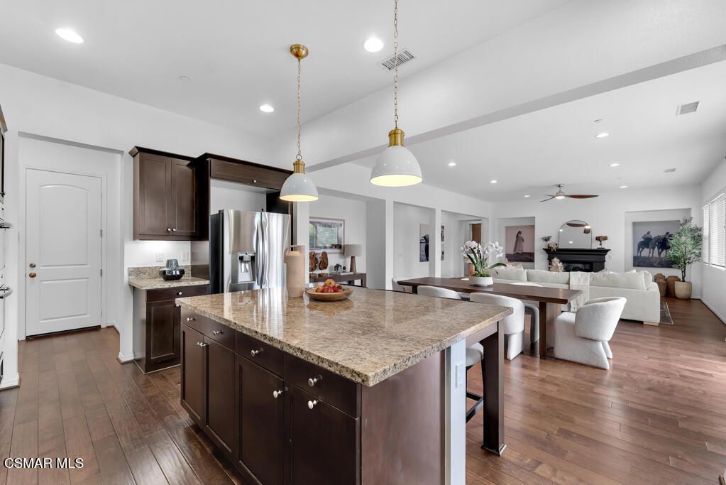 Dining room, Fireplace, Interior, Kitchen, Living room, Pendant Lights, Recessed Lighting, Stainless Steel Appliances, Wood Texture Flooring