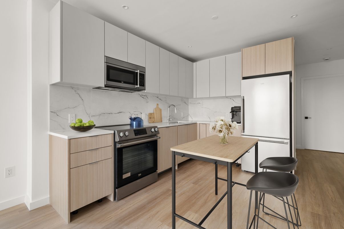 Interior, Kitchen, Marble Walls, Recessed Lighting, Stainless Steel Appliances, Wood Texture Flooring