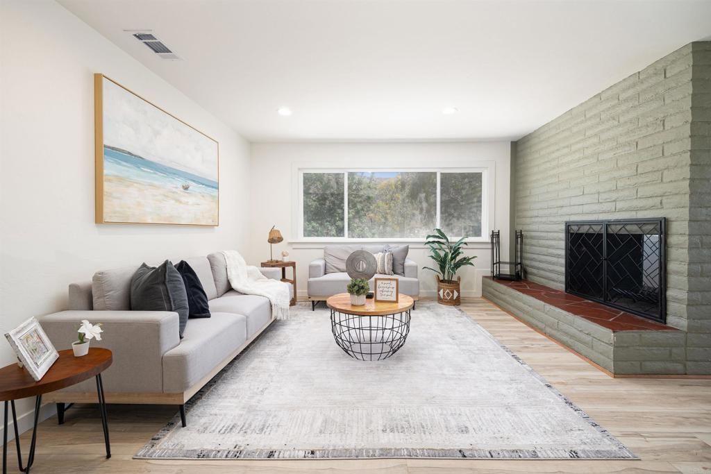 Fireplace, Interior, Living room, Recessed Lighting, Stone Walls, Wood Texture Flooring
