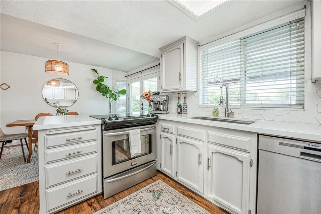 Dining room, Interior, Kitchen, Pendant Lights, Stainless Steel Appliances, Wood Texture Flooring