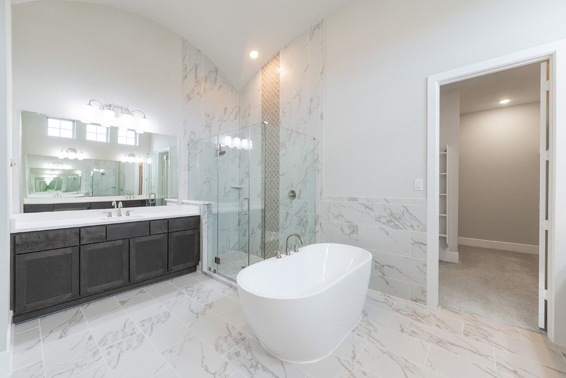 Bathroom, Dual Sink Vanities, Free Standing Baths, Glass Shower, Interior, Marble, Marble Walls, Recessed Lighting