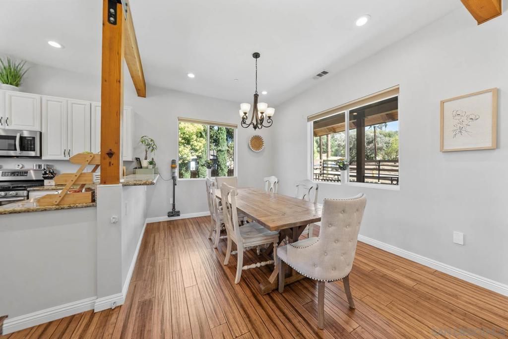 Chandelier, Dining room, Interior, Kitchen, Pendant Lights, Recessed Lighting, Stainless Steel Appliances, Wooden Beams, Wood Texture Flooring