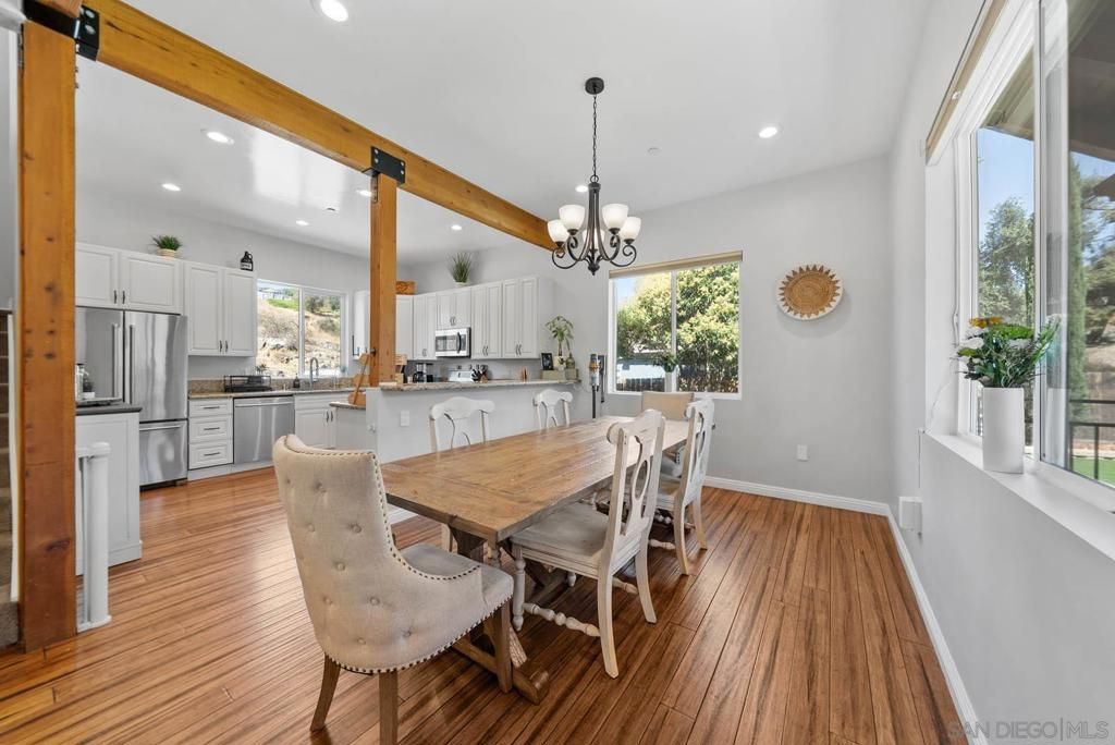 Chandelier, Dining room, Interior, Kitchen, Pendant Lights, Recessed Lighting, Stainless Steel Appliances, Wooden Beams, Wood Texture Flooring