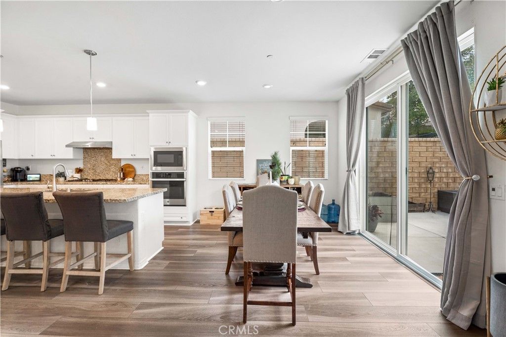 Dining room, Interior, Kitchen, Pendant Lights, Recessed Lighting, Stainless Steel Appliances, Wood Texture Flooring