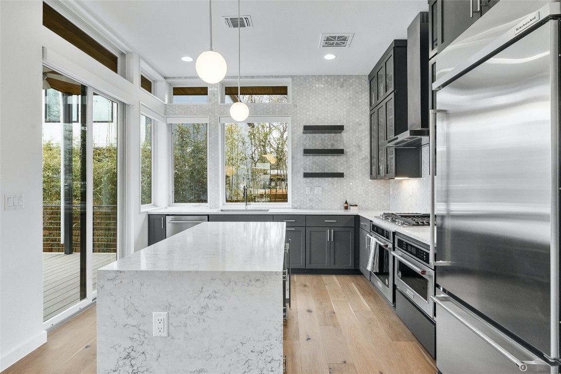 Interior, Kitchen, Pendant Lights, Recessed Lighting, Stainless Steel Appliances, Wood Texture Flooring