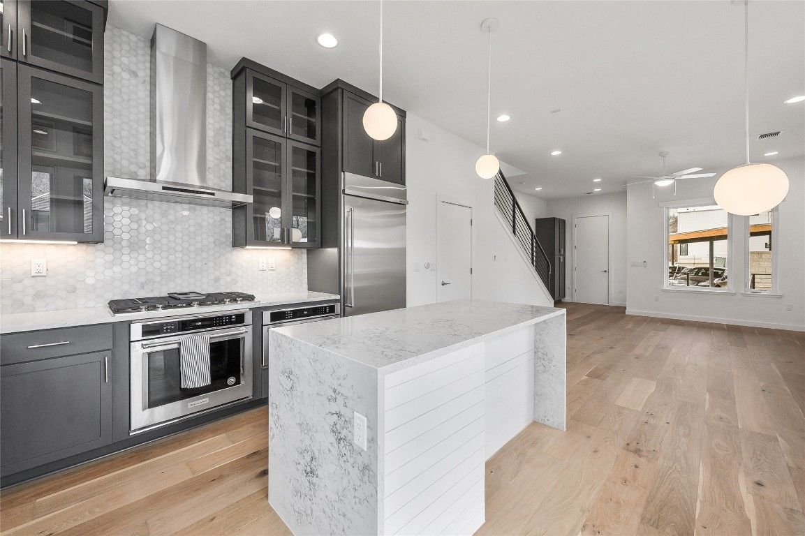 Interior, Kitchen, Pendant Lights, Recessed Lighting, Stainless Steel Appliances, Wood Texture Flooring
