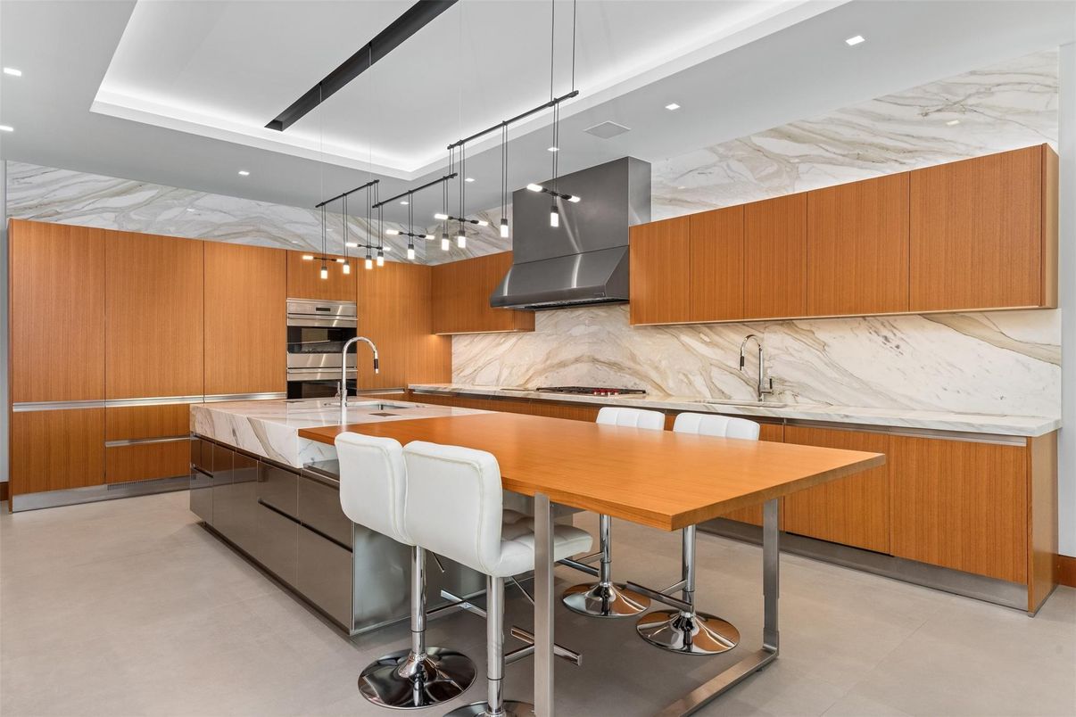 Interior, Kitchen, Marble Walls, Pendant Lights, Recessed Lighting, Stainless Steel Appliances