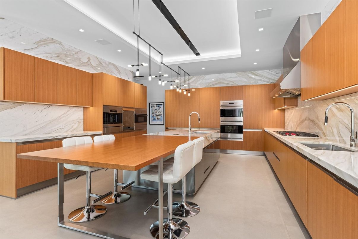 Interior, Kitchen, Marble Walls, Pendant Lights, Recessed Lighting, Stainless Steel Appliances