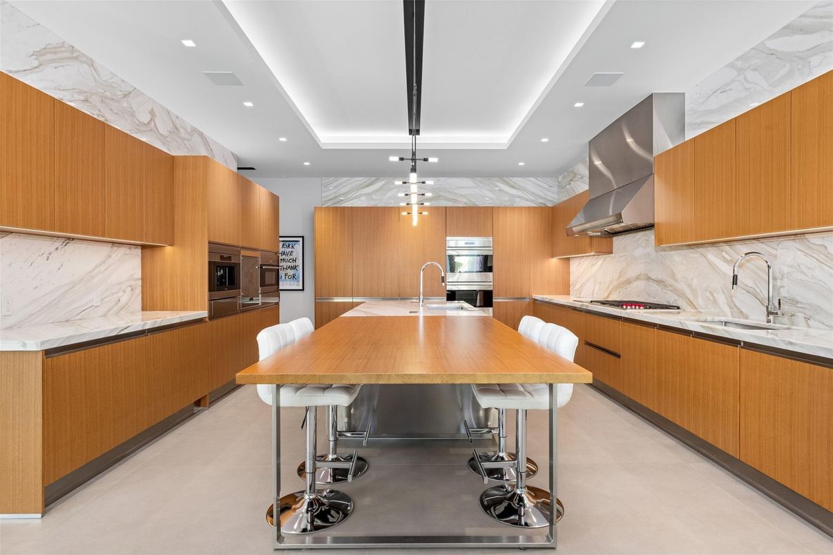 Interior, Kitchen, Marble Walls, Pendant Lights, Recessed Lighting, Stainless Steel Appliances