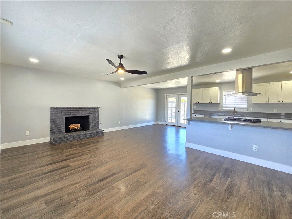 Empty room, Fireplace, Interior, Kitchen, Recessed Lighting, Wood Texture Flooring